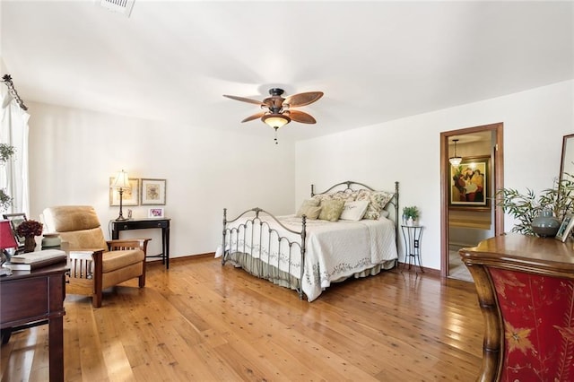 bedroom featuring hardwood / wood-style floors and ceiling fan