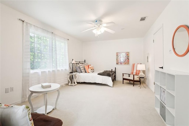 carpeted bedroom with ceiling fan