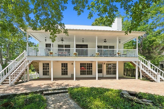 rear view of house featuring a porch