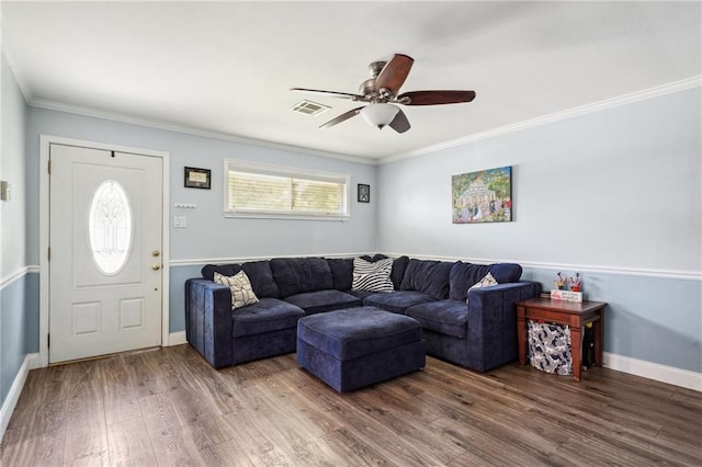 living room with ceiling fan, ornamental molding, and wood-type flooring