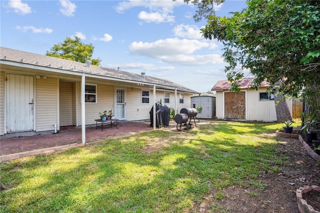 view of yard with a patio area and a shed