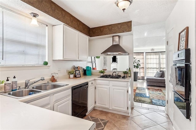 kitchen with white cabinets, sink, wall chimney range hood, dishwasher, and stainless steel gas stovetop