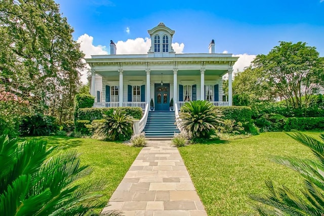 view of front of home featuring a front yard and covered porch