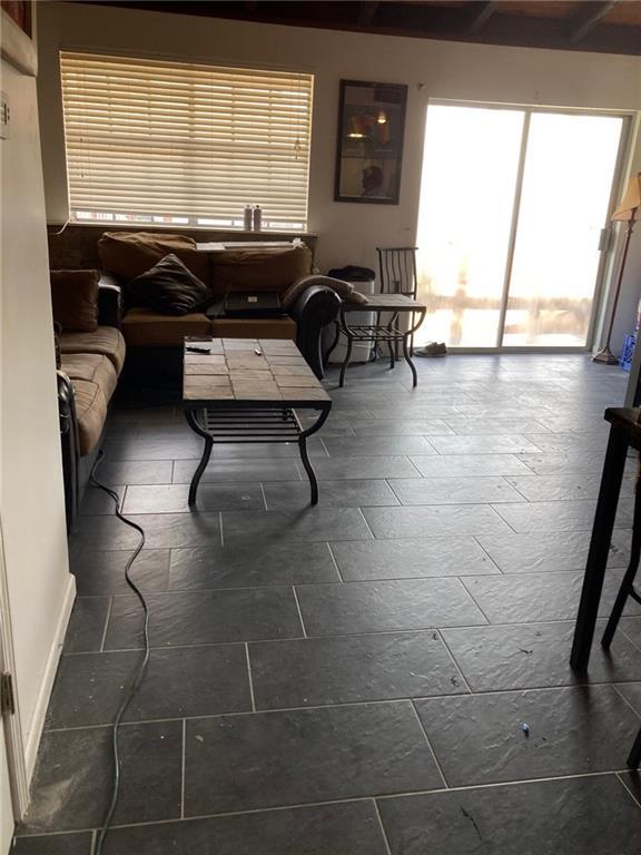 living room with dark tile patterned flooring