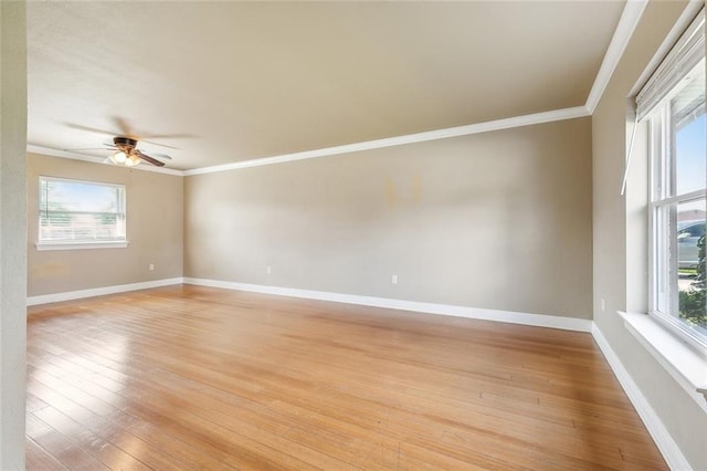 unfurnished room with ceiling fan, crown molding, and light wood-type flooring