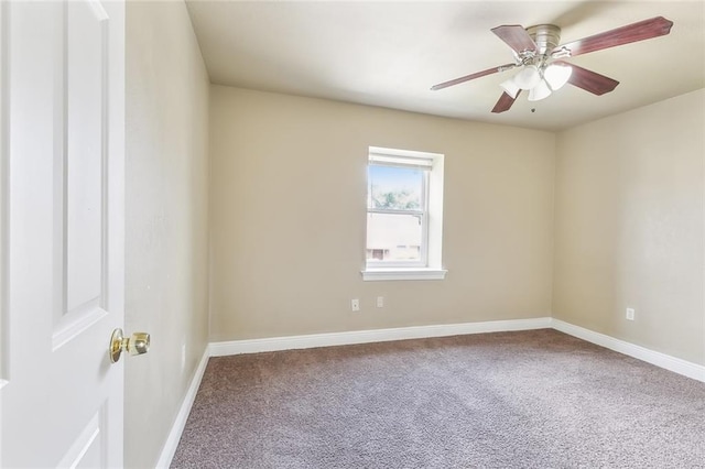 empty room with ceiling fan and carpet floors