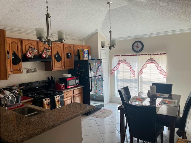 kitchen featuring light tile patterned floors, brown cabinets, black appliances, a chandelier, and a sink