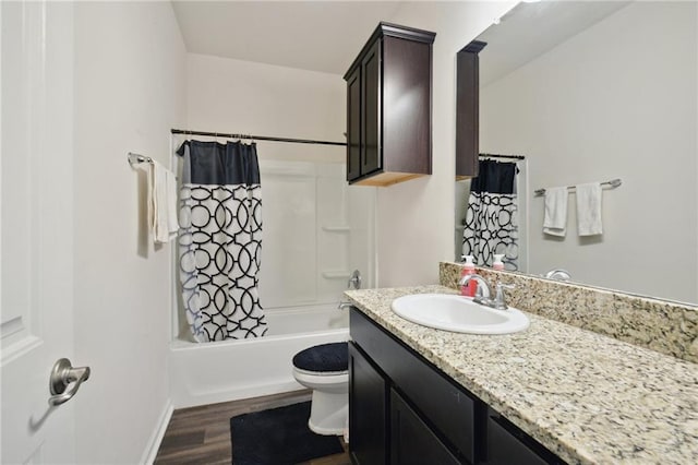 full bathroom with vanity, wood-type flooring, toilet, and shower / bath combo with shower curtain