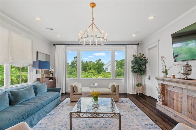 living room with crown molding, a notable chandelier, and dark hardwood / wood-style flooring