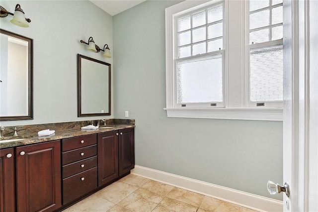 bathroom with tile patterned floors and vanity