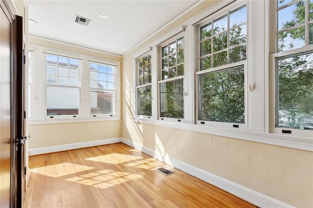 unfurnished sunroom featuring a wealth of natural light