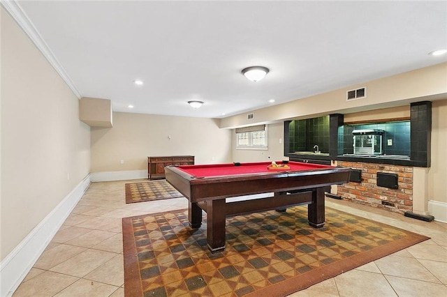 rec room featuring sink, light tile patterned floors, ornamental molding, and pool table