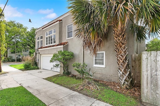 view of side of home with a garage