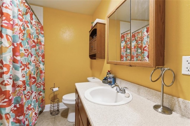 full bathroom featuring toilet, tile patterned flooring, baseboards, and vanity