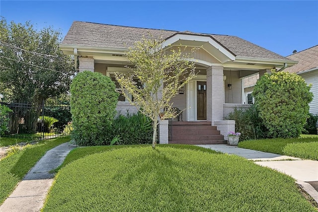 bungalow featuring a front yard