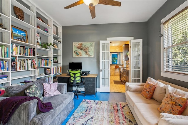 office space featuring ceiling fan, french doors, and dark hardwood / wood-style flooring