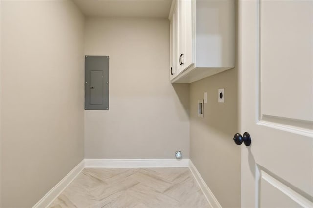 laundry room with cabinets, electric panel, hookup for a washing machine, and electric dryer hookup