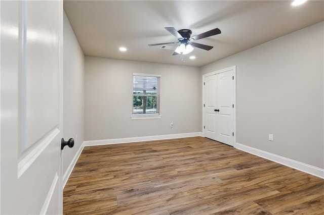 unfurnished room featuring wood-type flooring and ceiling fan