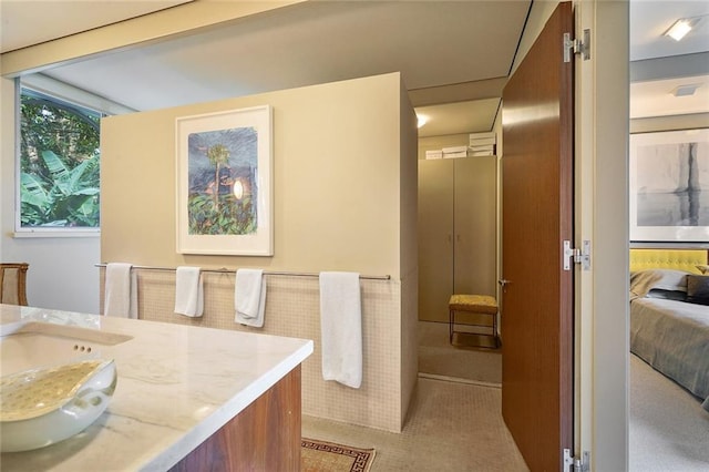 bathroom featuring tile patterned flooring and vanity