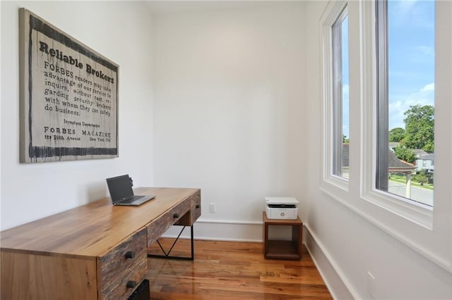 office space with hardwood / wood-style floors