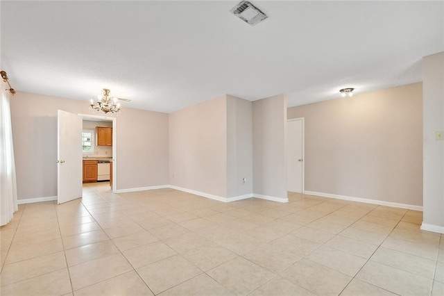 spare room featuring light tile patterned flooring