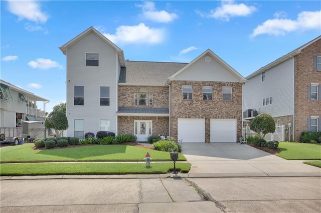 view of front of home featuring a garage and a front yard