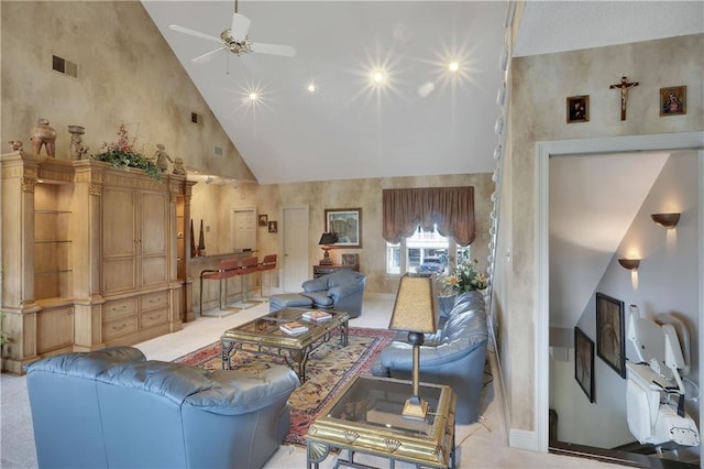 living room with ceiling fan and high vaulted ceiling