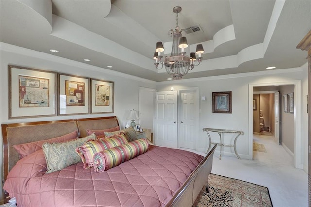 bedroom featuring ornamental molding, a raised ceiling, carpet floors, and a notable chandelier