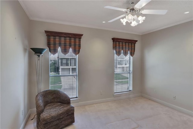 sitting room with ornamental molding and ceiling fan