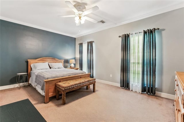 carpeted bedroom with crown molding and ceiling fan