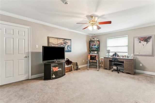 home office featuring crown molding, light colored carpet, and ceiling fan