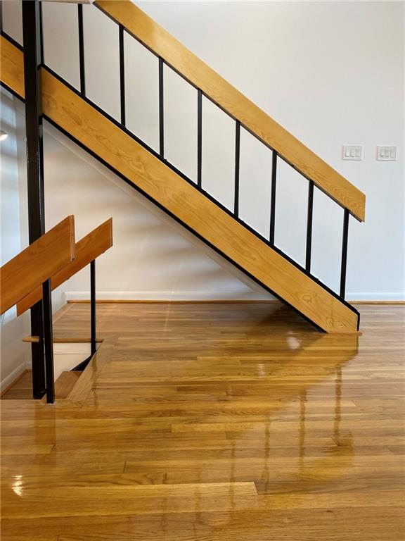 staircase featuring light hardwood / wood-style floors