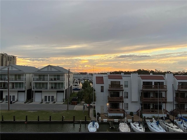 outdoor building at dusk featuring a water view