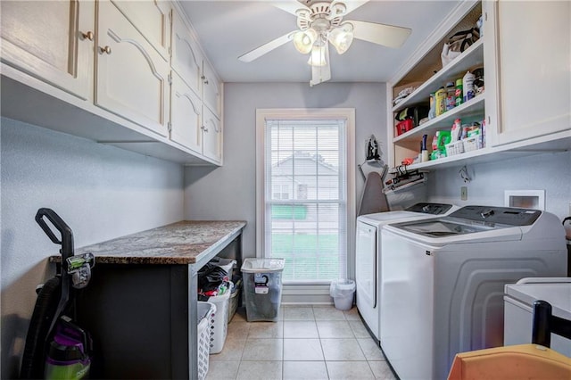 washroom featuring ceiling fan, light tile patterned floors, cabinets, and independent washer and dryer