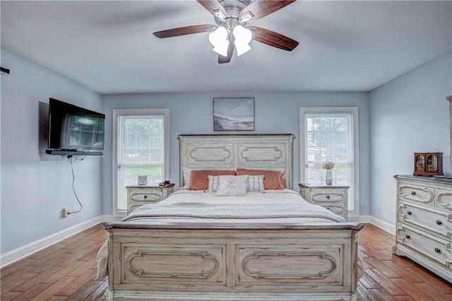 bedroom with ceiling fan and light hardwood / wood-style flooring