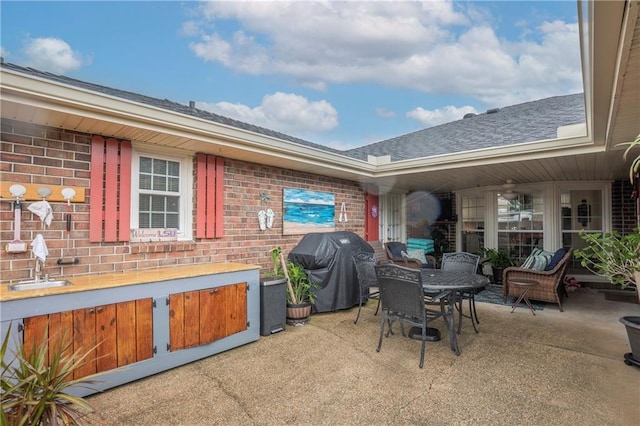 view of patio / terrace with area for grilling and sink