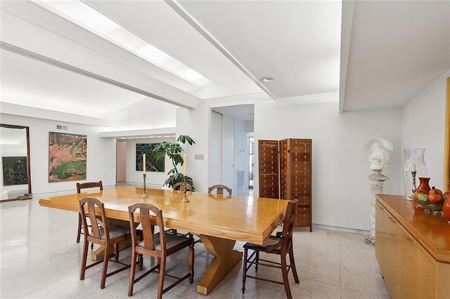 dining room featuring beam ceiling