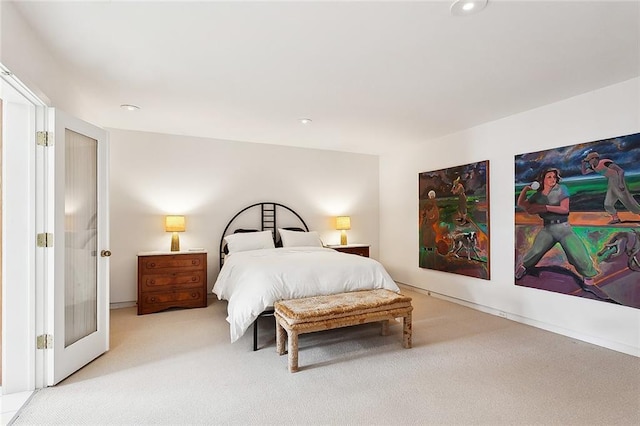 bedroom with light colored carpet