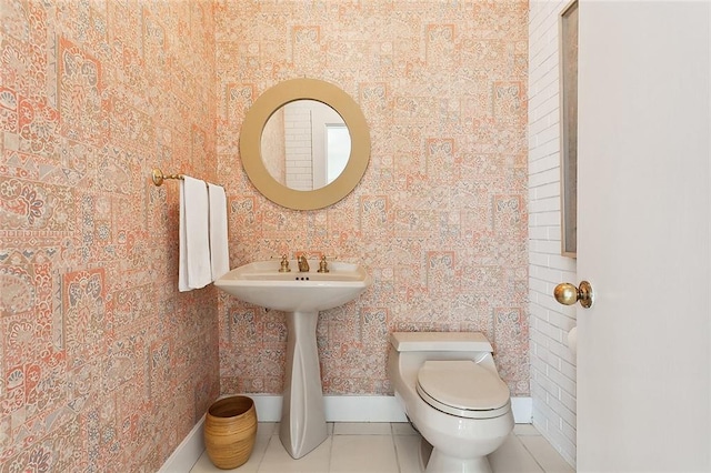 bathroom featuring tile patterned floors and toilet