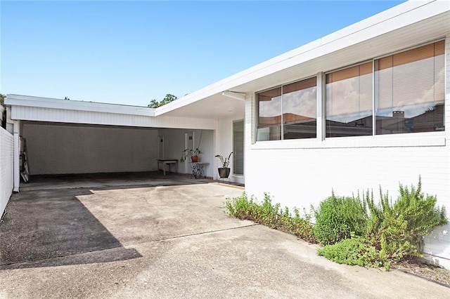 exterior space with a carport