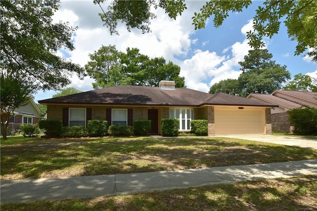 ranch-style house with a garage and a front yard