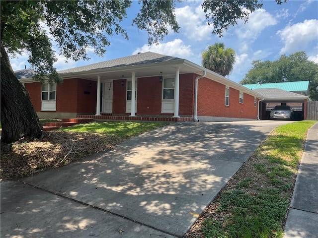 single story home featuring covered porch and a garage