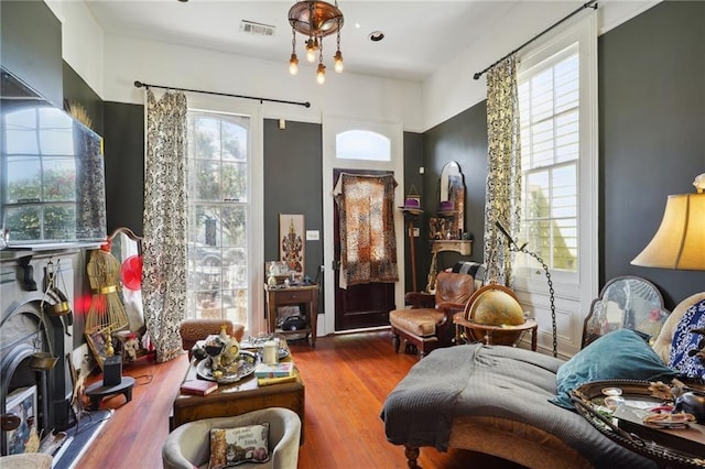 sitting room with wood-type flooring