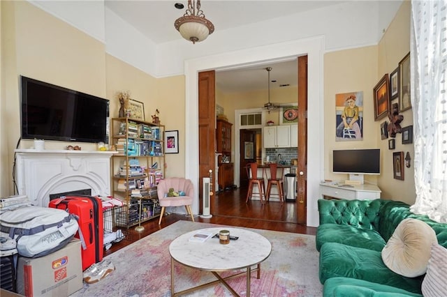 living room with dark hardwood / wood-style flooring