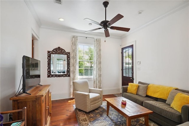 living area featuring ceiling fan, crown molding, and dark hardwood / wood-style flooring