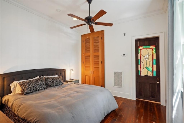 bedroom with ceiling fan, dark wood-type flooring, and ornamental molding