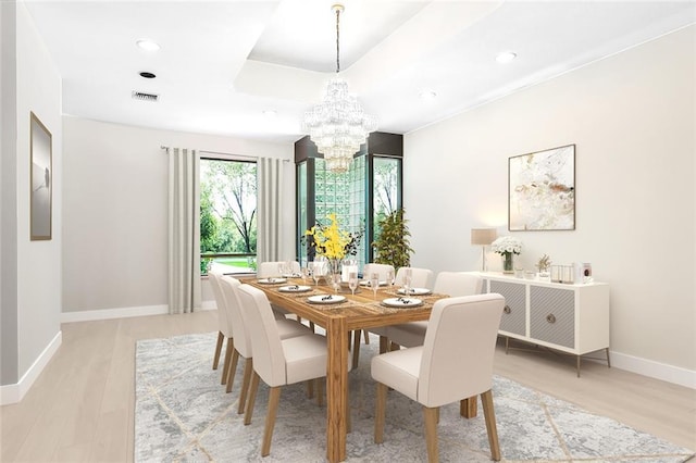 dining room featuring an inviting chandelier, recessed lighting, light wood-style floors, and baseboards