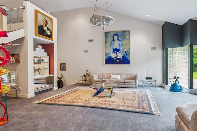 living room with visible vents, baseboards, carpet, a notable chandelier, and high vaulted ceiling