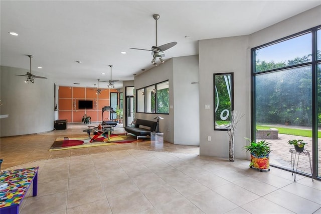 living area with tile patterned flooring, recessed lighting, and ceiling fan