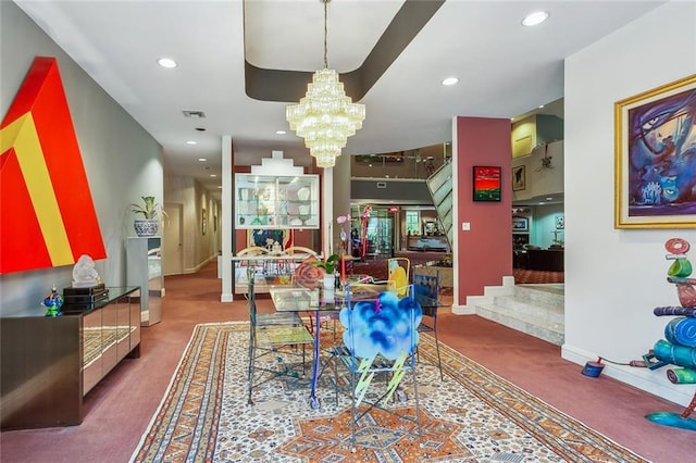 dining room with visible vents, baseboards, carpet floors, recessed lighting, and a notable chandelier